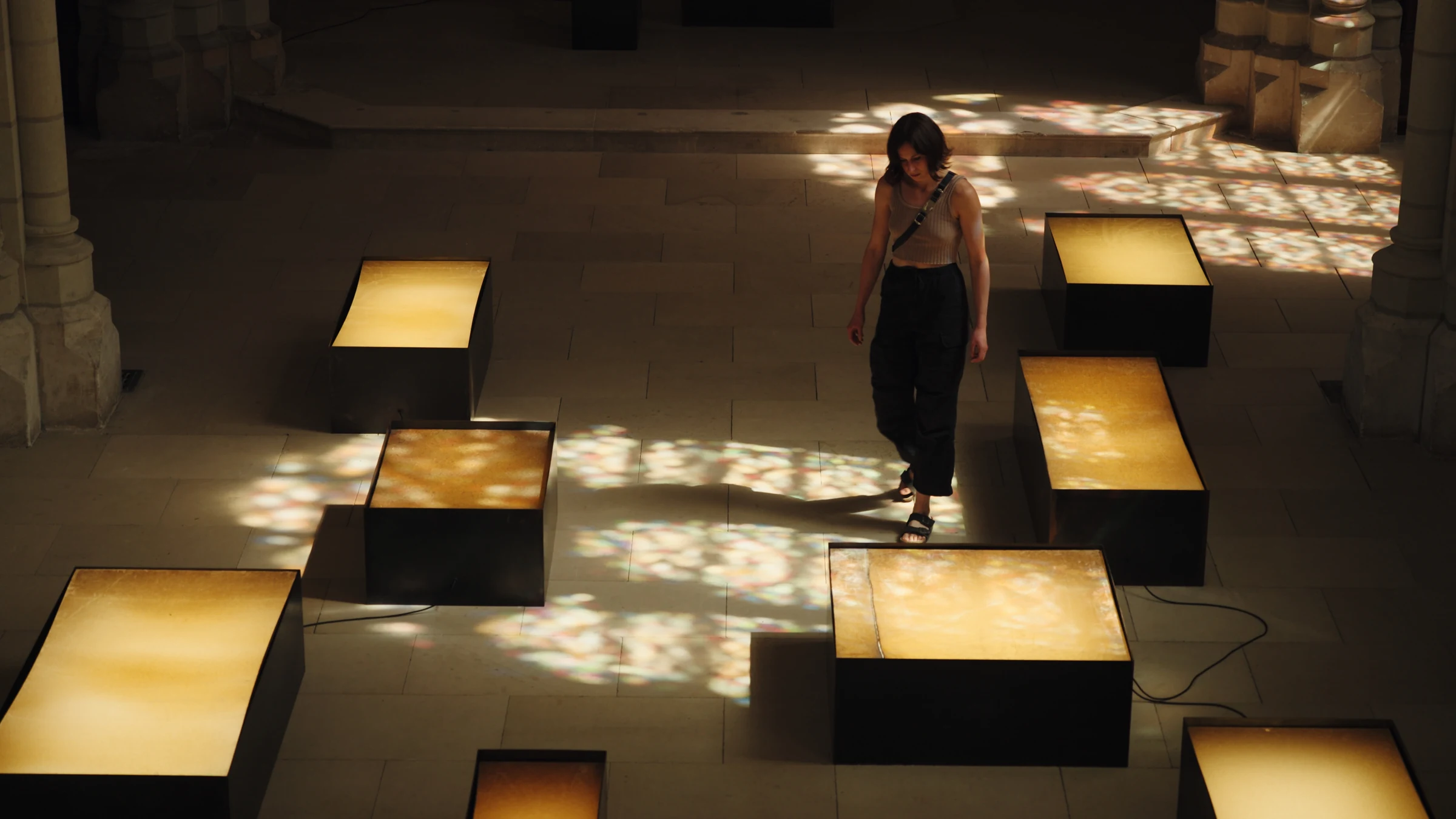 Elise walking among illuminated installations