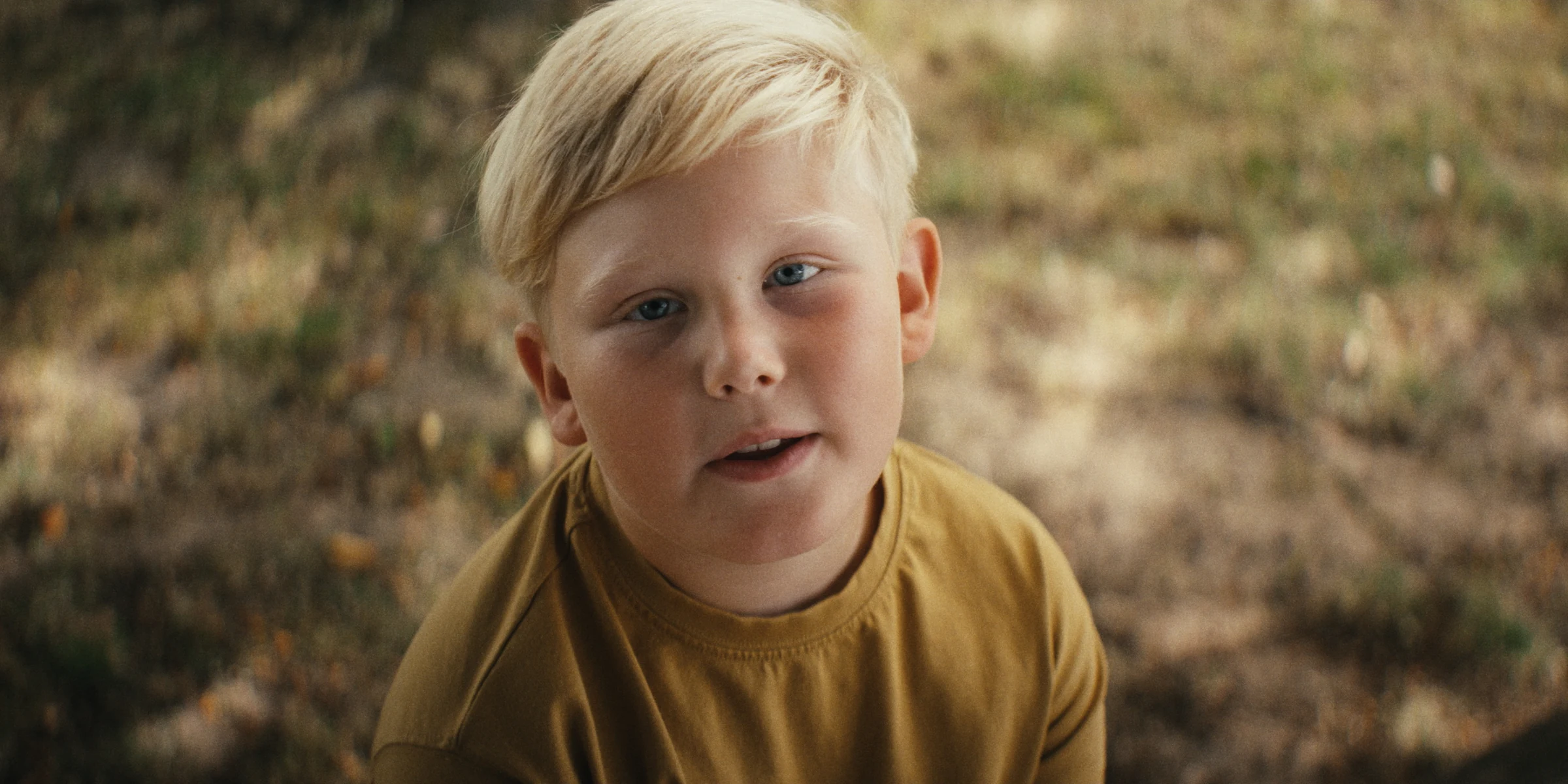 Portrait of a child in a yellow shirt
