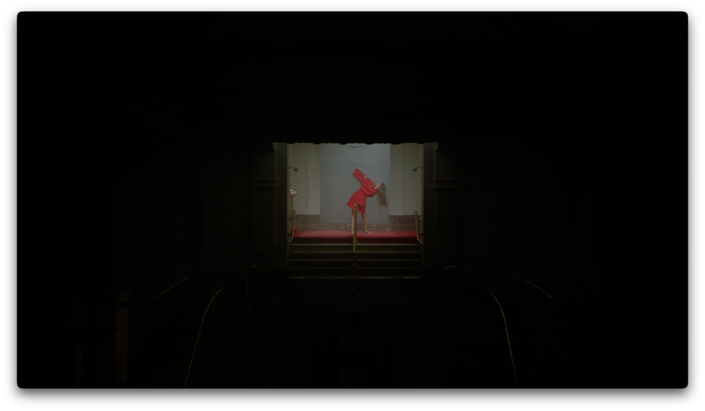 Gioia Seghers — Distant red dancer through the dark staircase