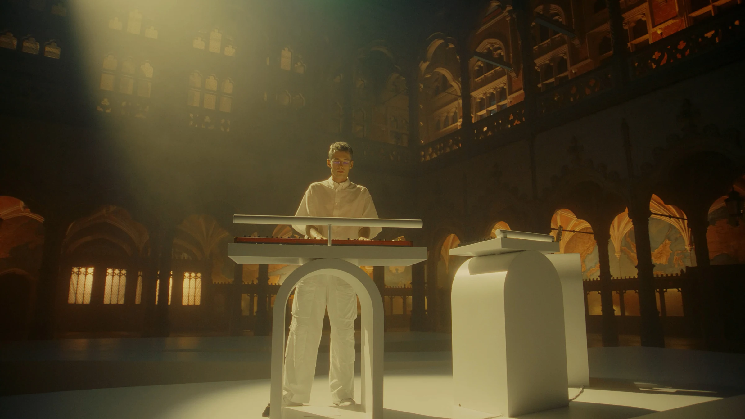 Lost Frequencies performing at the keyboard in golden light