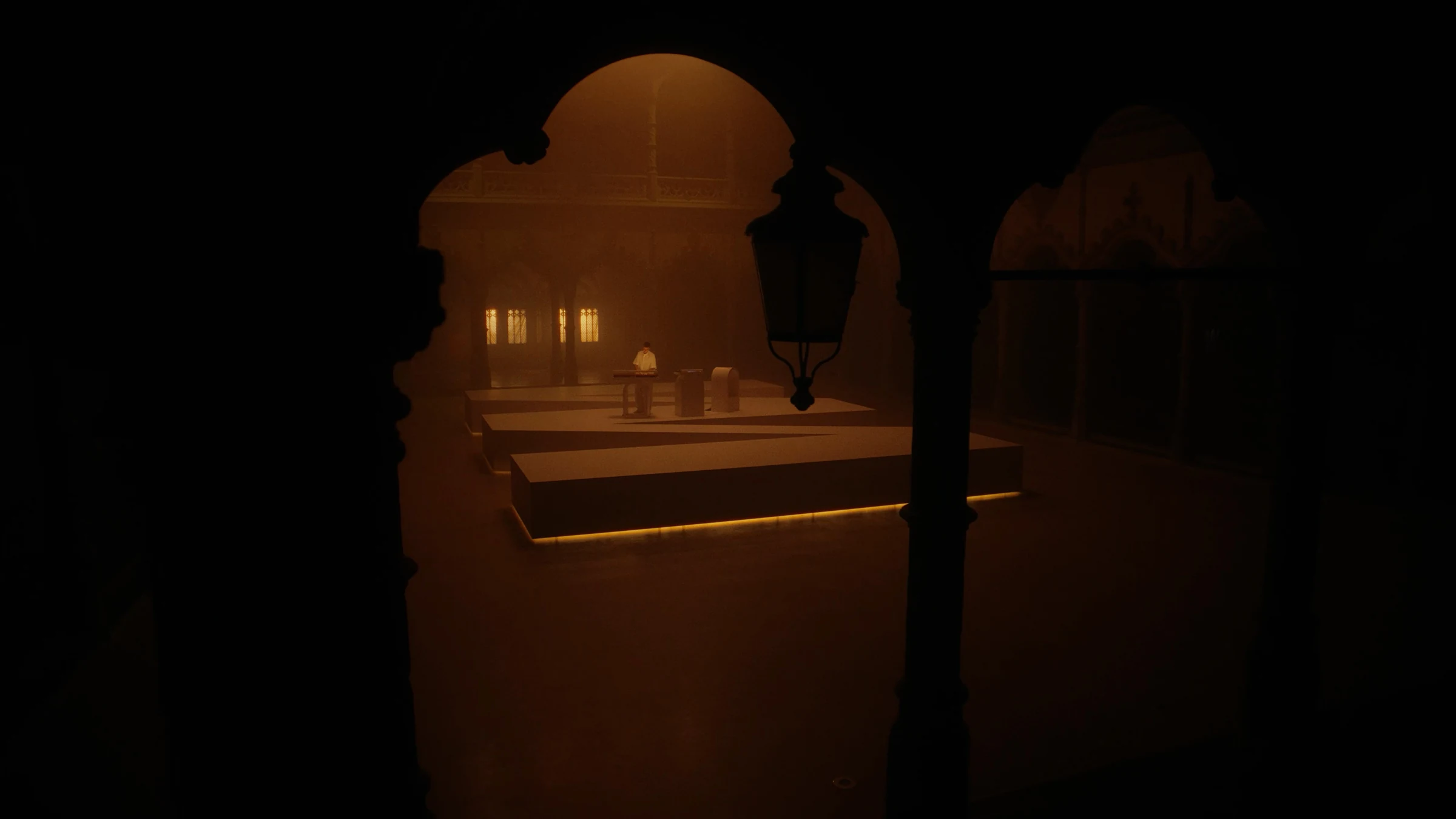 Amber-lit stage framed by dark arches