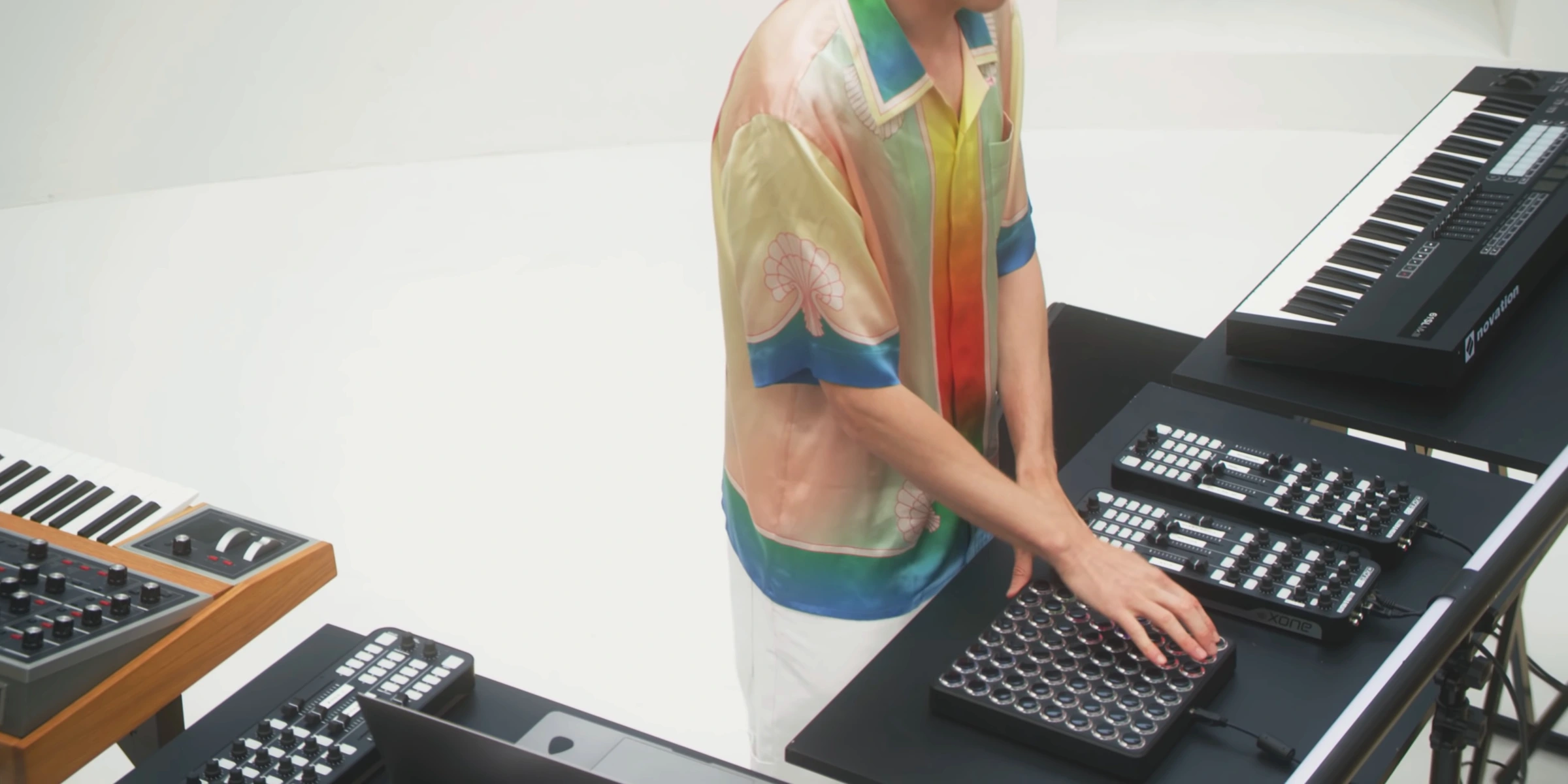 Hands playing the synthesizers