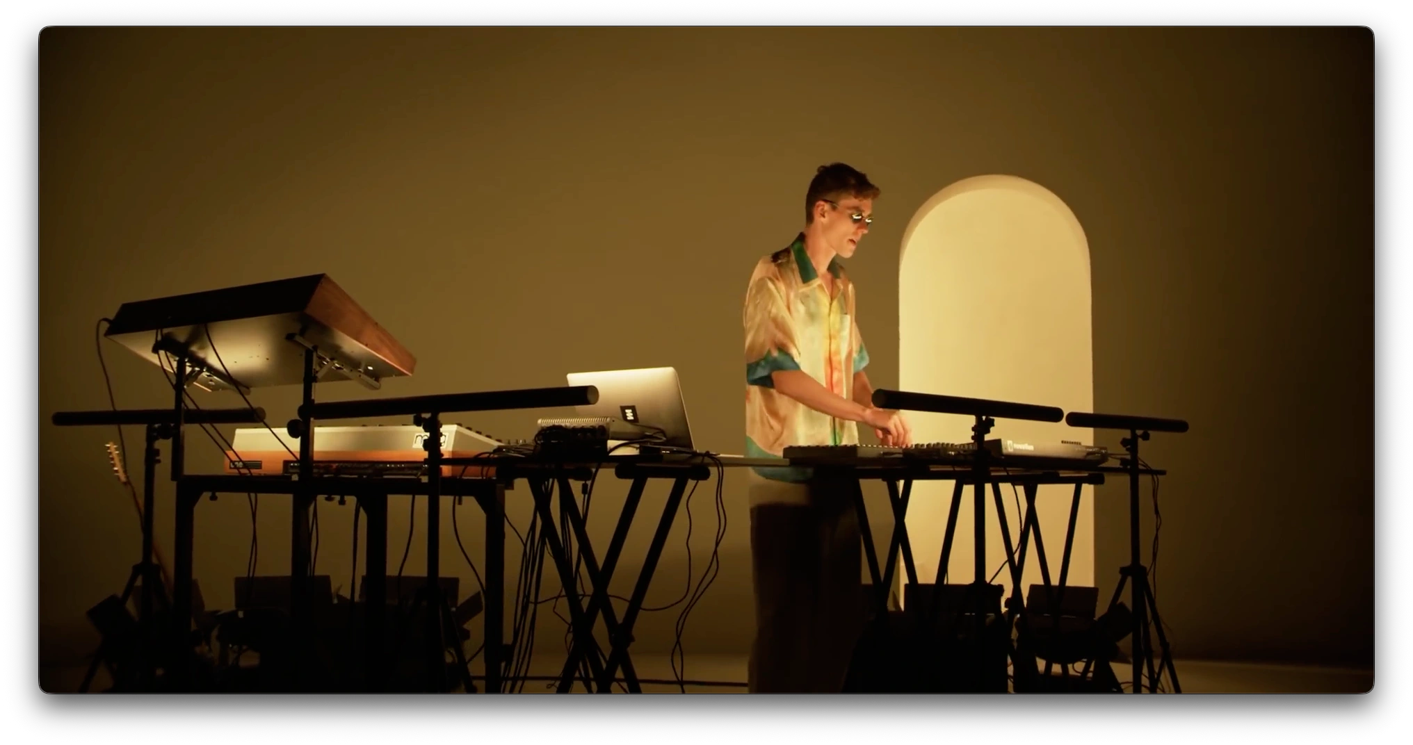 Lost Frequencies performing in golden light