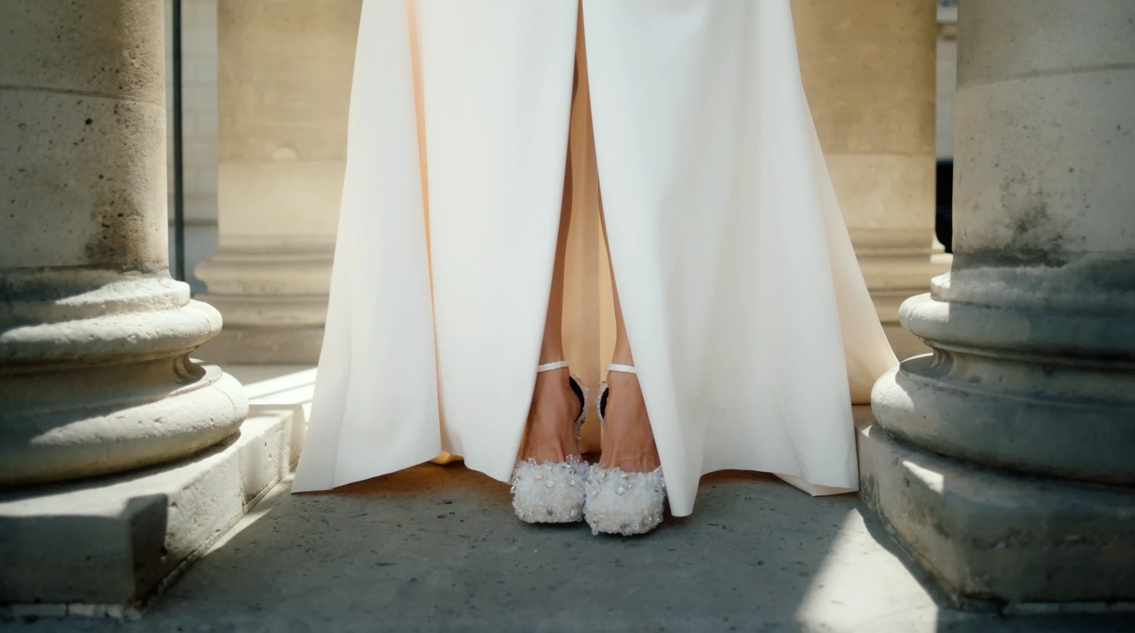 White couture dress and embellished shoes