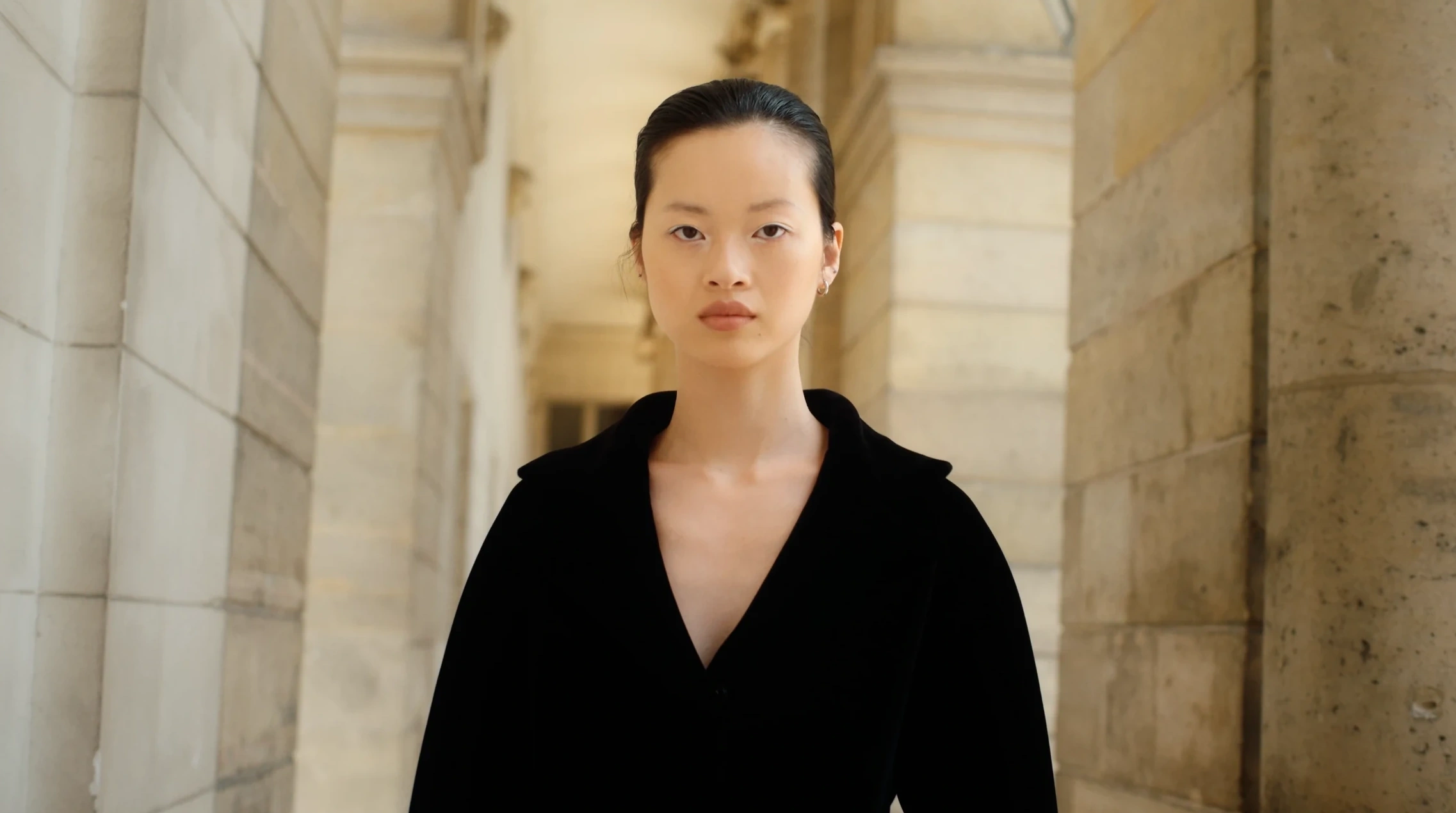 Portrait in a black couture coat