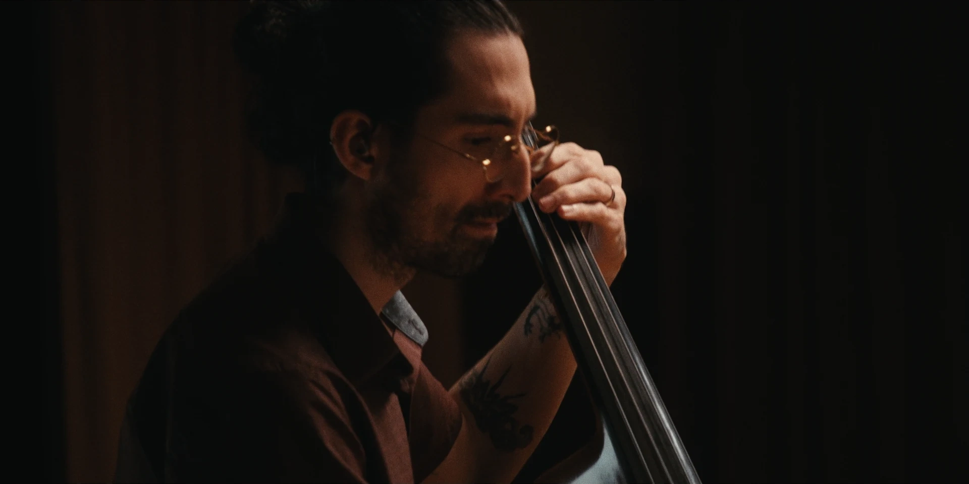 Double bassist absorbed in the performance