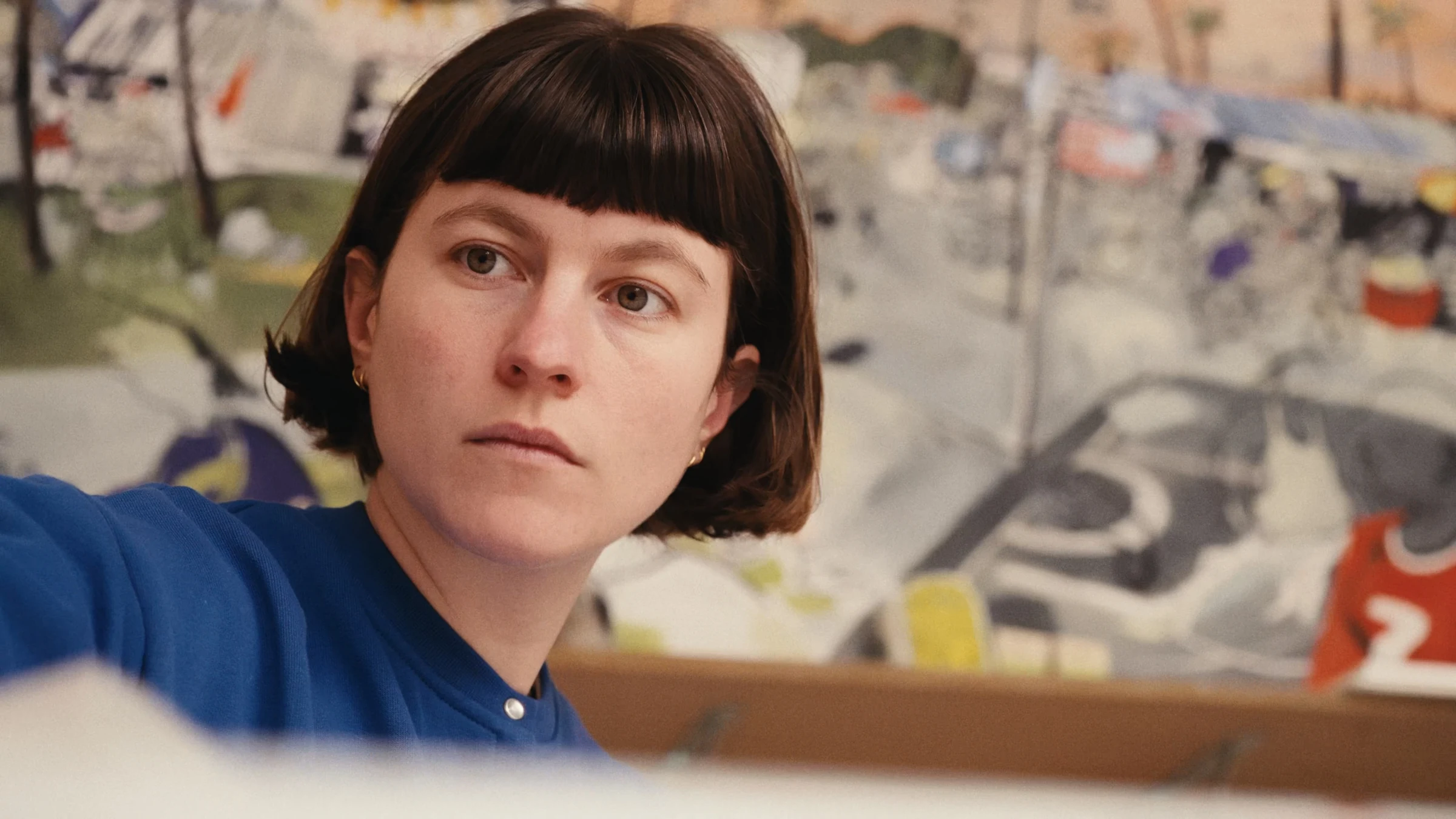 Portrait of Philippine in blue in her studio