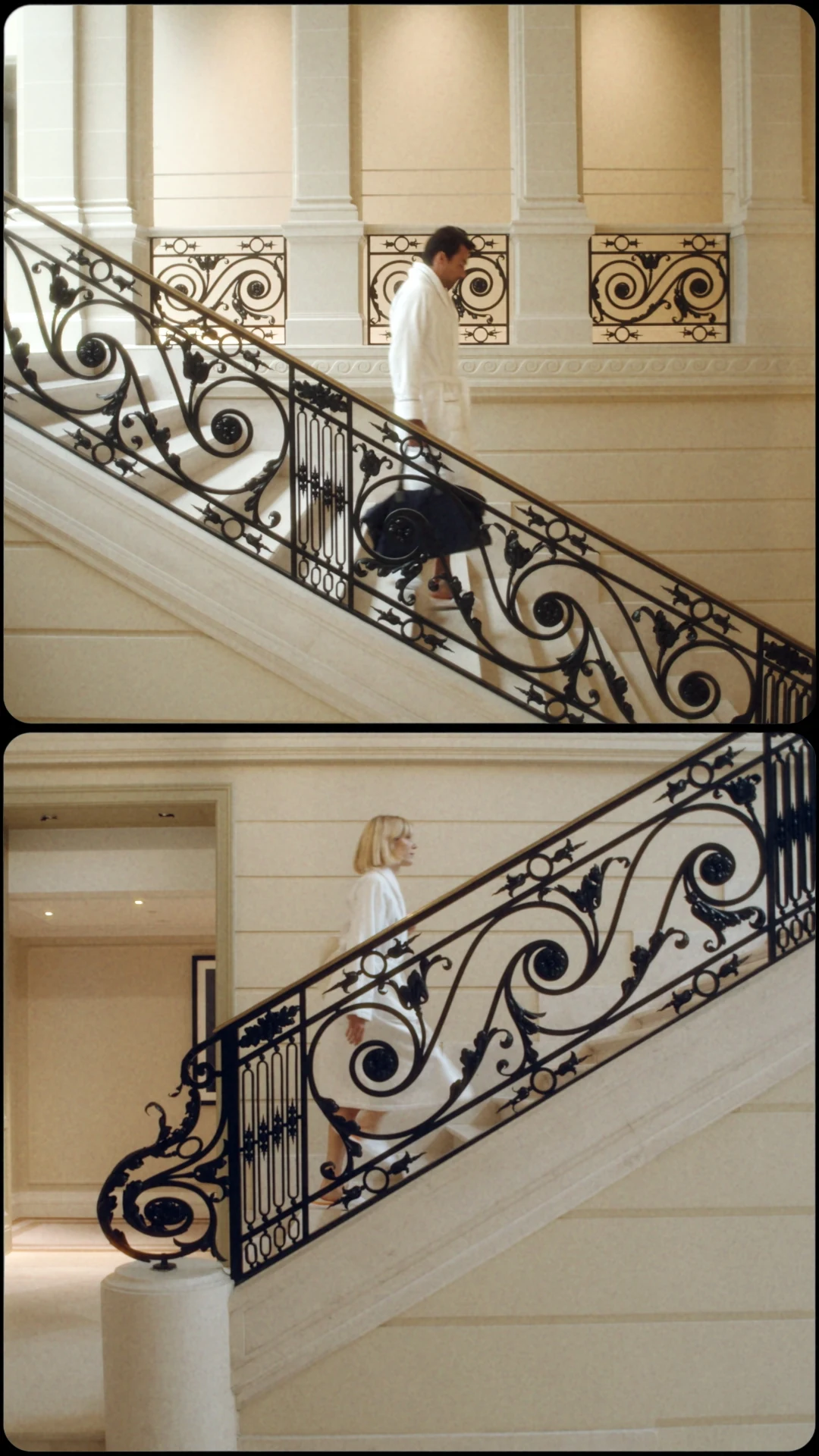 Two figures on the hotel staircase