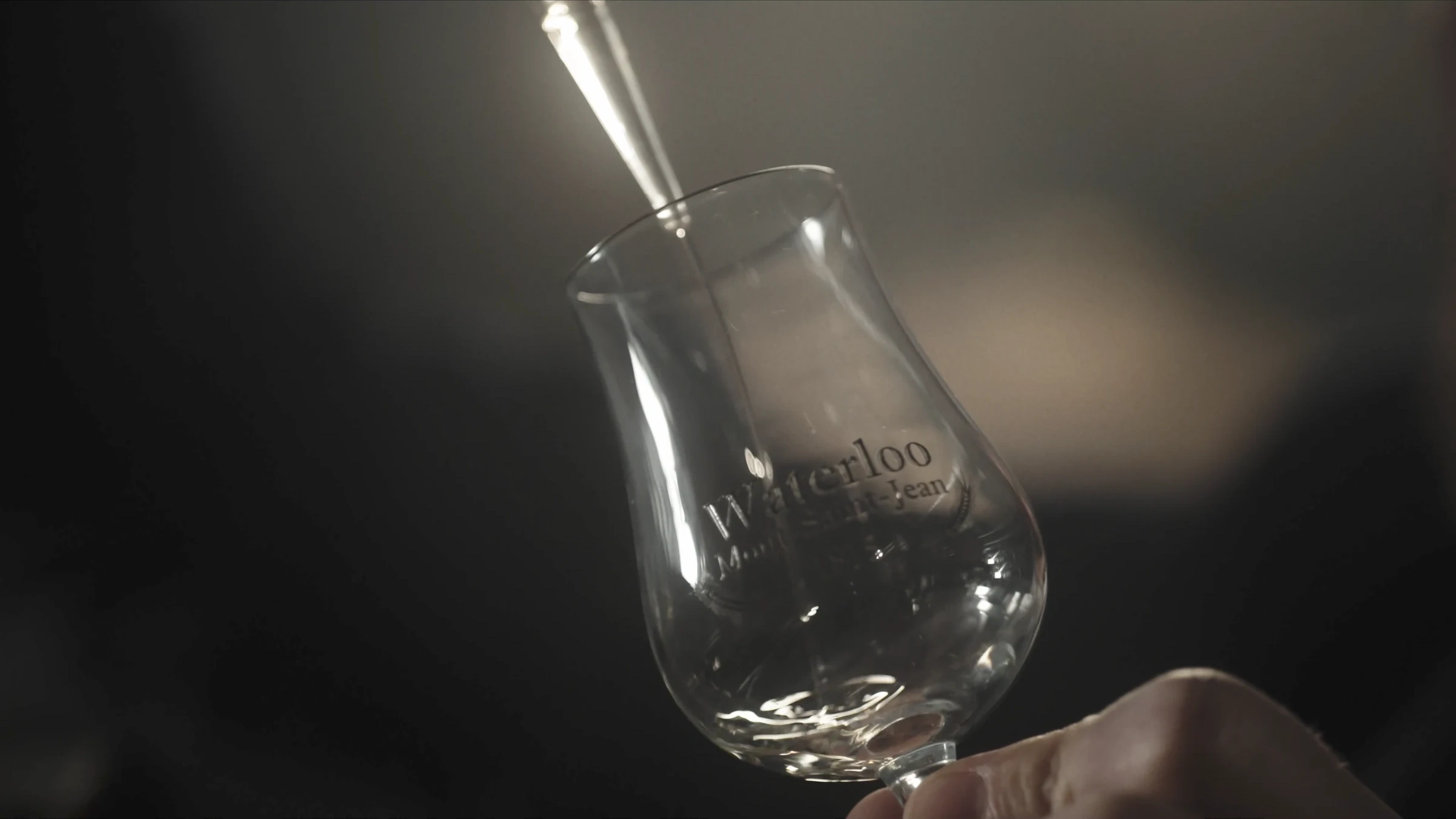 A pipette filling a Waterloo tasting glass
